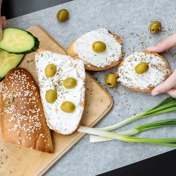Woman cooking. Vegan snacks. Female hands cooking healthy sandwiches.